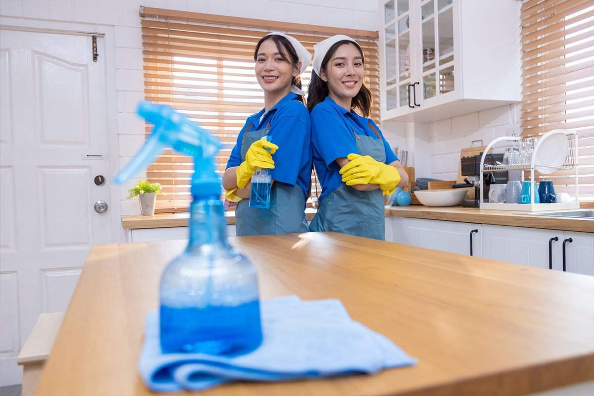 Two Clean Corner cleaners in a kitchen after a deep clean